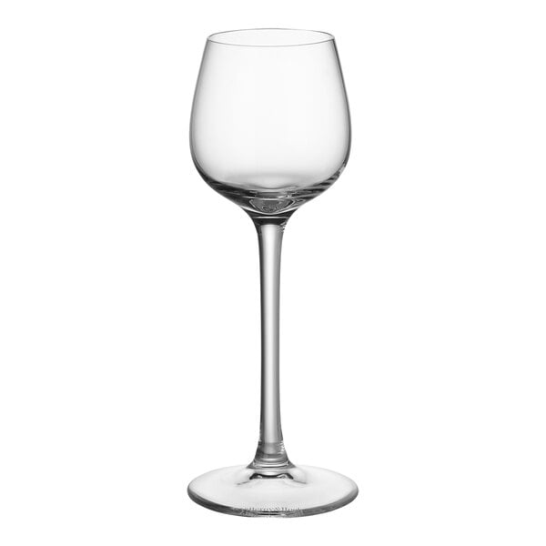 A close-up of a clear Villeroy & Boch cordial wine glass with a long stem.