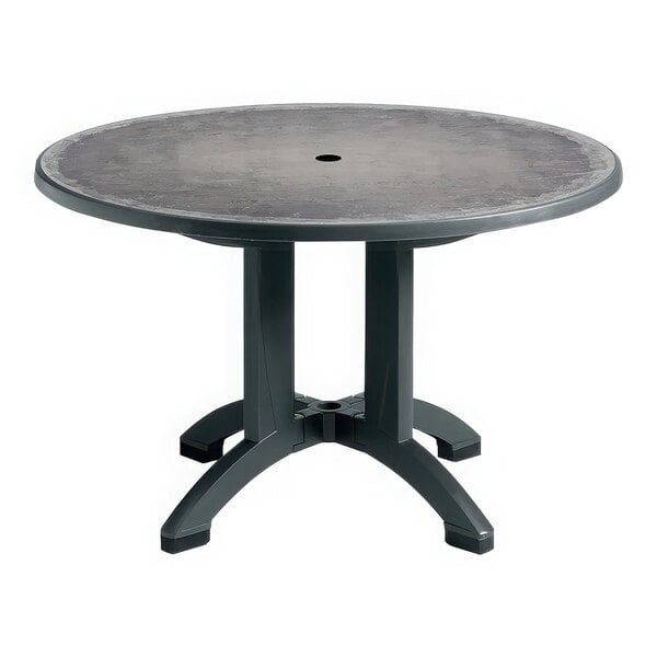 A Grosfillex Aquaba round table with a zinc top and charcoal legs.