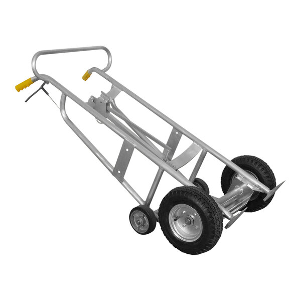 A silver Wesco Industrial Products aluminum hand truck with black wheels and a brake handle.