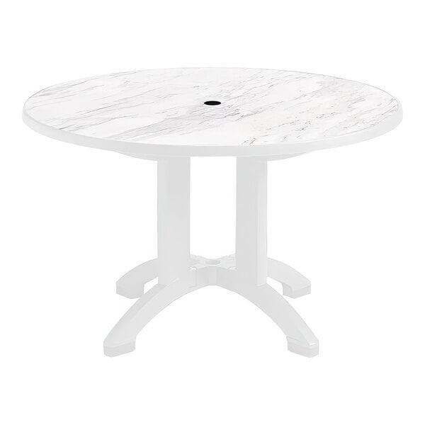 A white Grosfillex round table with a white top.