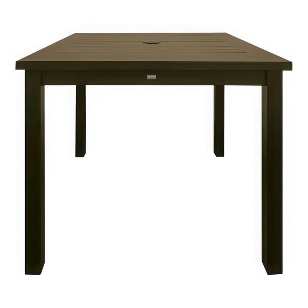 A Grosfillex Sigma bronze aluminum dining table with a square top on a table outdoors.