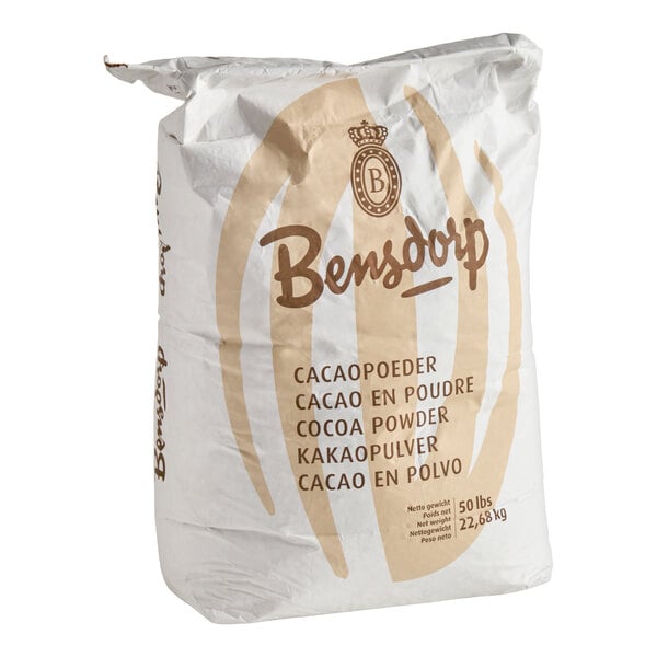 A large white bag labeled 'Bensdorp Cocoa Powder' with multilingual text and a weight of 50 lbs (22.68 kg).