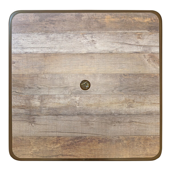 A Grosfillex wood square table with bronze legs.