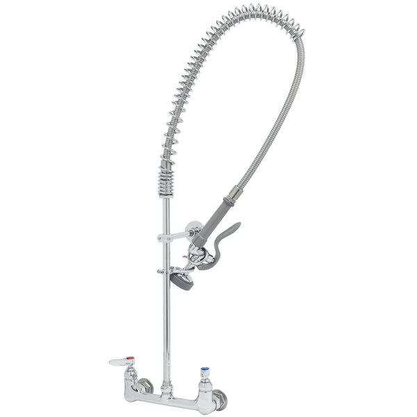 A silver T&S wall mounted pre-rinse faucet with a hose.