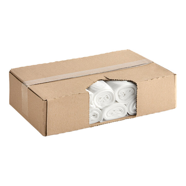 A cardboard box of clear EcoStrong Plus trash bags.