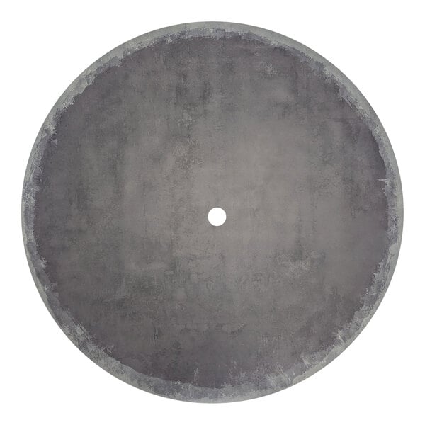 A Grosfillex round zinc resin table top with a hole in the center on charcoal legs.