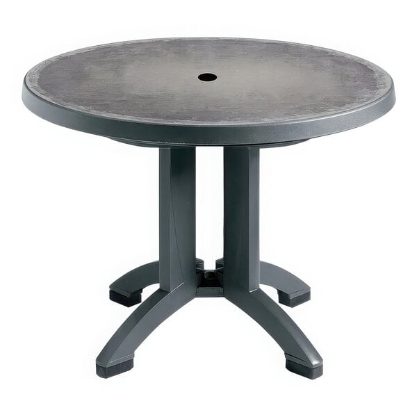 A Grosfillex round table with a charcoal top and legs.