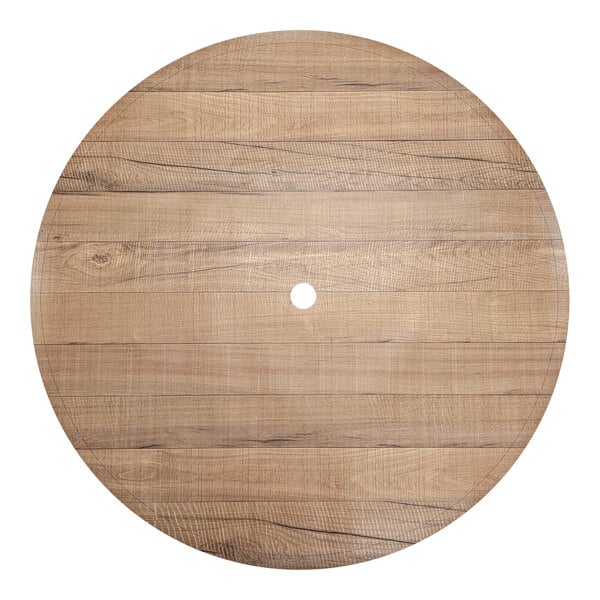 A circular wood surface with a hole in the center.