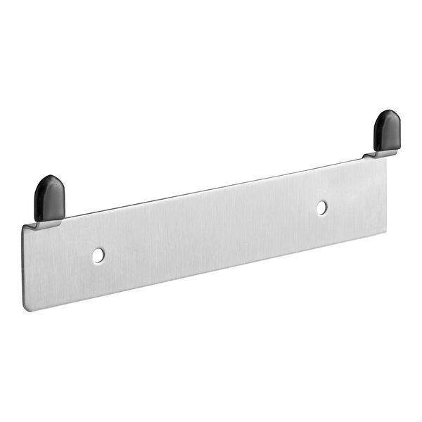 A stainless steel Pak-Sher wall mount with two black buttons and two holes.