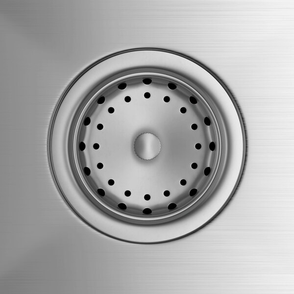 A Regency stainless steel sink drain with holes in it.