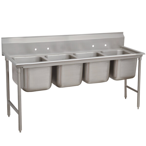 A stainless steel Advance Tabco pot sink with four compartments.