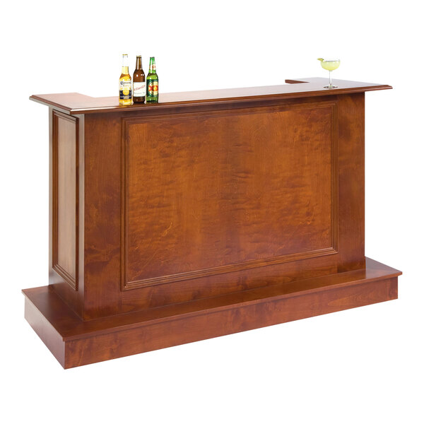 A Lakeside wooden portable bar with bottles and glasses on top.