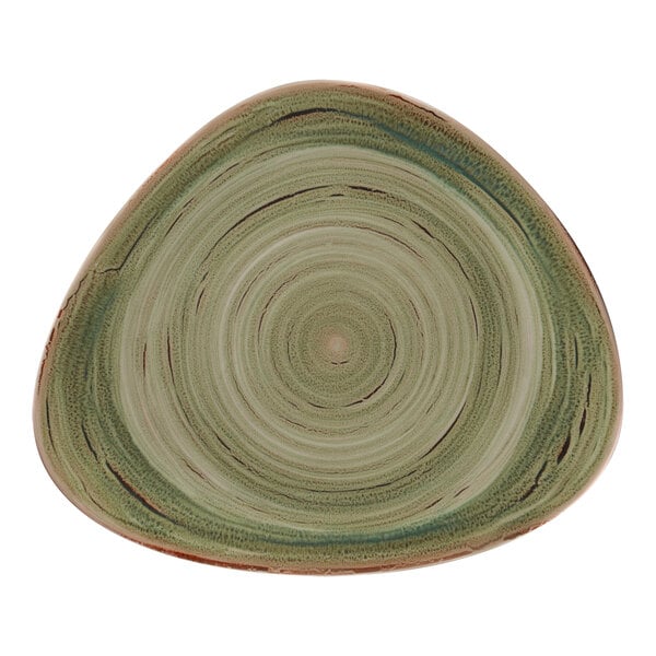 A close up of a RAK Porcelain green plate with a spiral pattern.