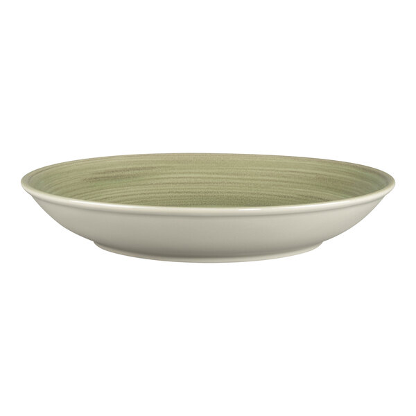 A white porcelain deep coupe plate with a green rim.