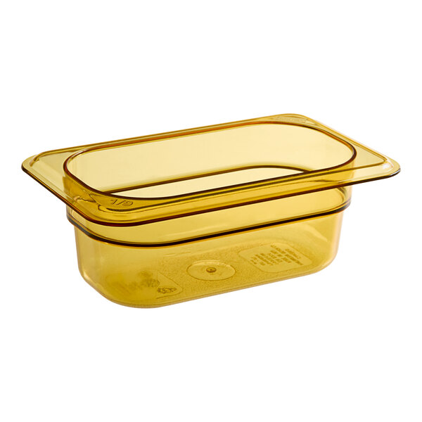 A yellow Cambro H-Pan plastic food pan with a lid.