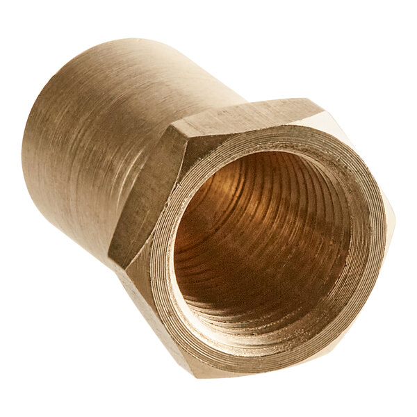 A close-up of a brass threaded nut.