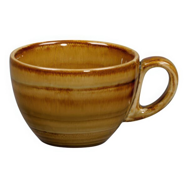 A brown and white RAK Porcelain coffee cup with a handle.