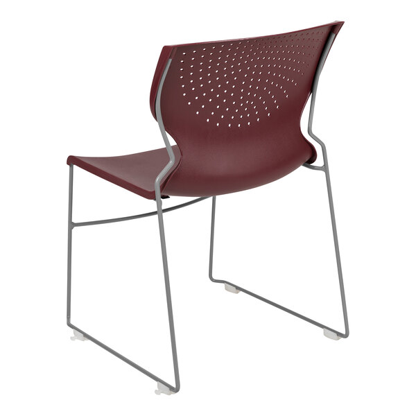 A burgundy Flash Furniture stacking chair with a metal sled base.