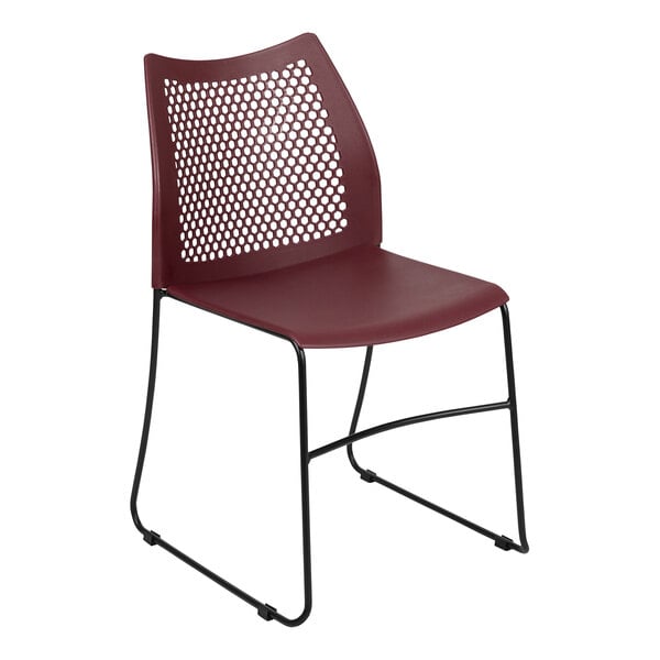 A Flash Furniture burgundy plastic banquet chair with black legs.