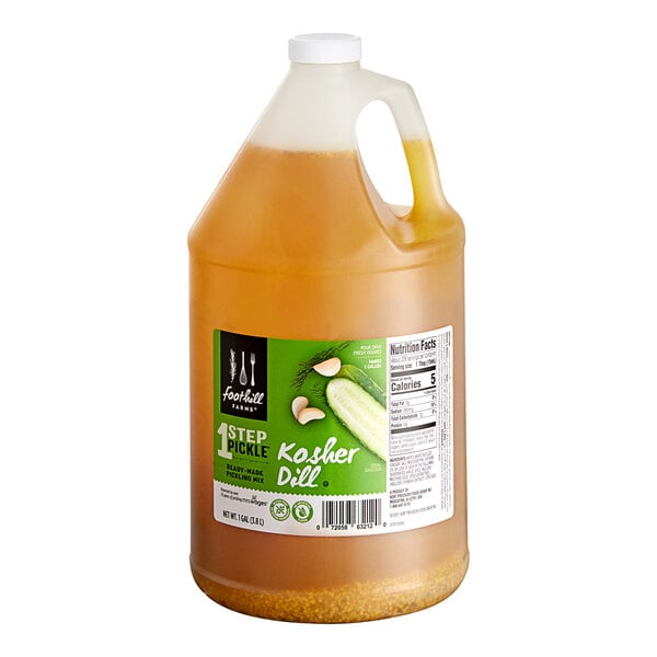 A jug of Foothill Farms Kosher Dill Pickle Brine on a counter.