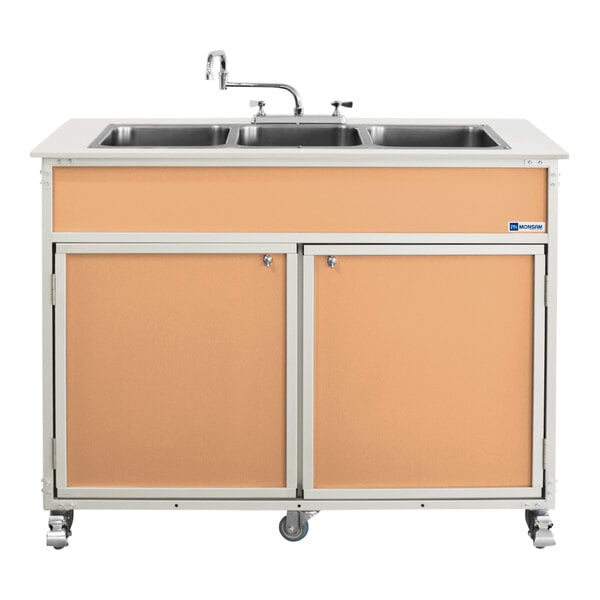 A Monsam portable commercial sink with three deep maple basins in a cabinet on wheels.