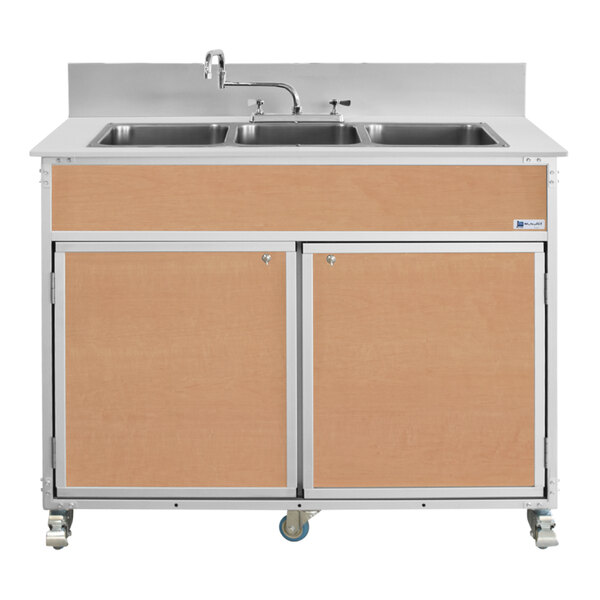 A portable commercial sink with three deep stainless steel basins, a maple wood finish, and locking wheels.