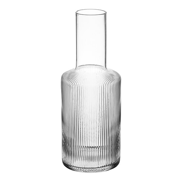 An Acopa Lore clear glass ribbed vase with a neck.