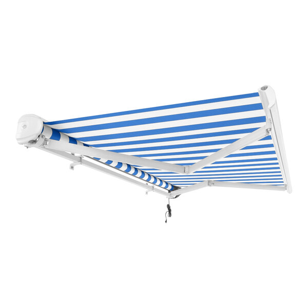 An Awntech Key West blue and white striped retractable patio awning on a wall with a protective hood.