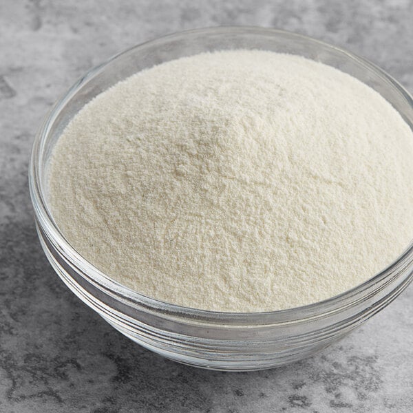 A bowl of Foothill Farms Deluxe Alfredo Sauce Mix powder.