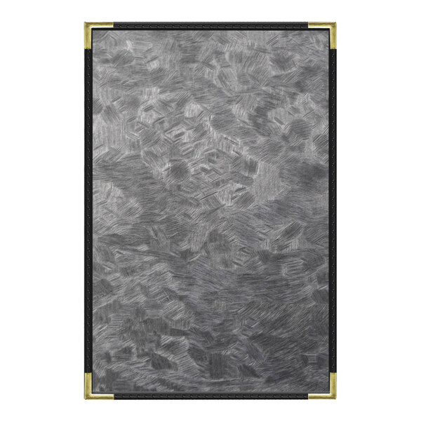 A close-up of a steel brushed metallic plate with a gold corner.