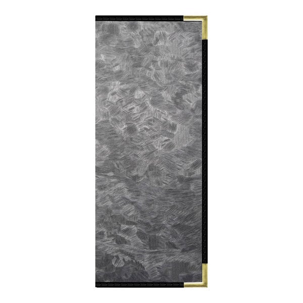 A rectangular metal menu cover with black and gold corners on a grey surface.