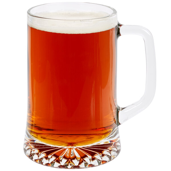 A Libbey glass beer mug filled with beer on a white background.