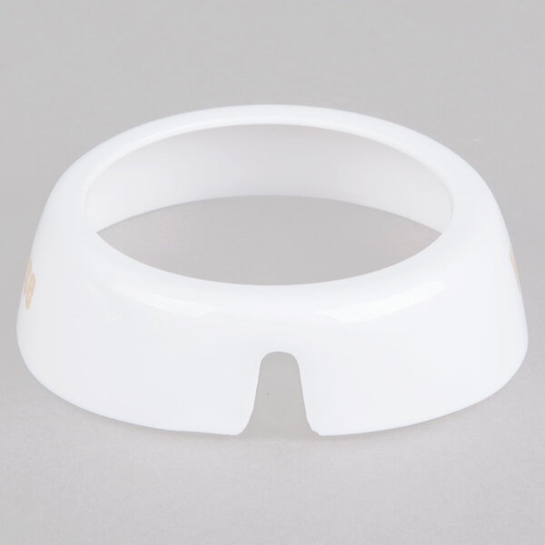 A white circular Tablecraft plastic dispenser collar with a hole in it.