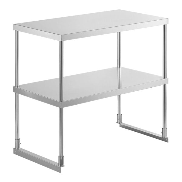 A stainless steel Avantco double deck overshelf with metal legs.