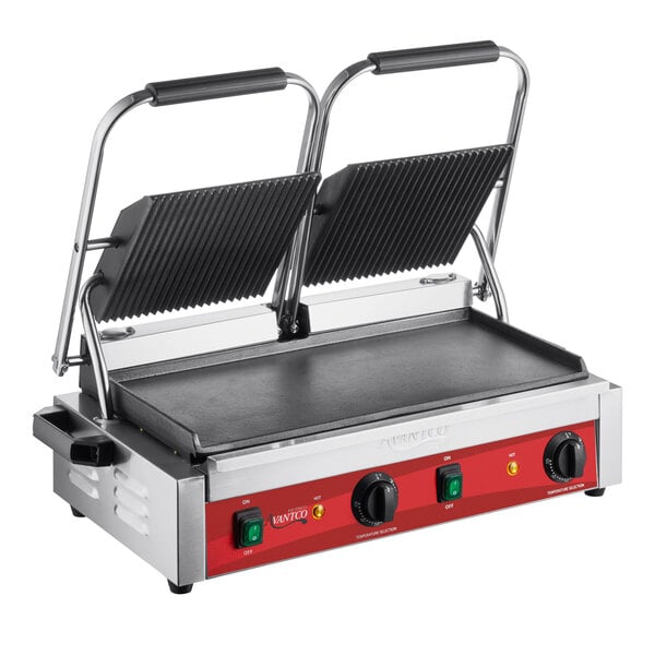 An Avantco commercial panini grill with a grooved top and smooth bottom plate on a table in a professional kitchen.