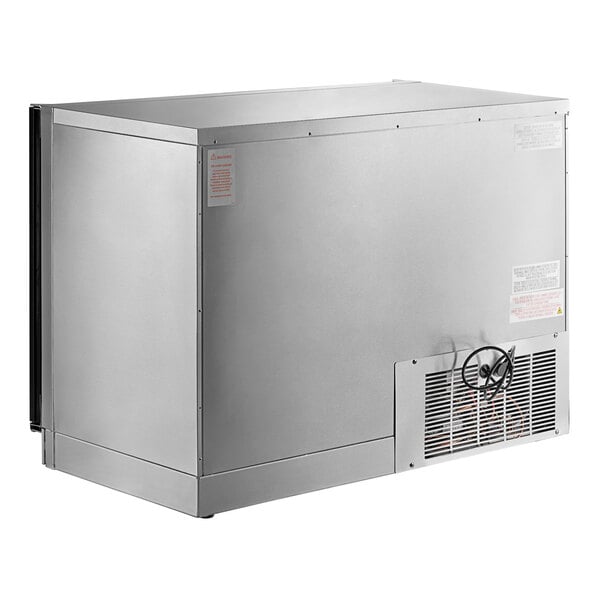 A silver Perlick undercounter refrigerator with two glass doors.