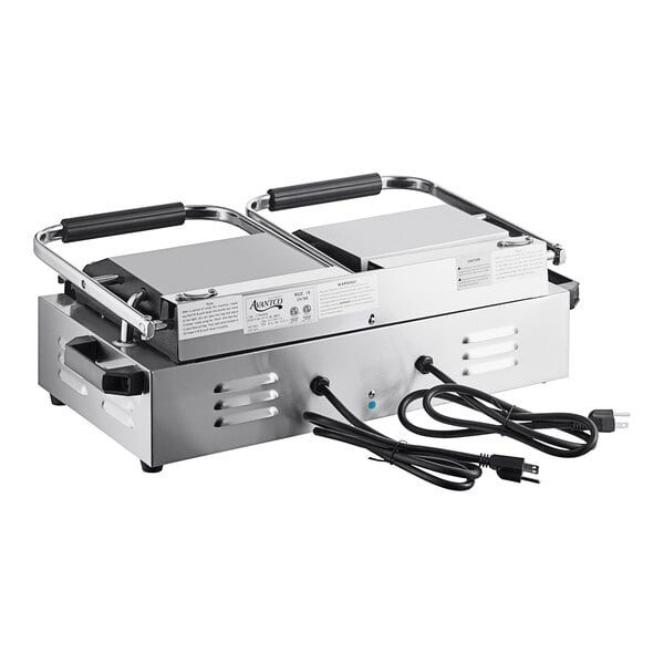 An Avantco stainless steel commercial dual panini sandwich grill on a counter.