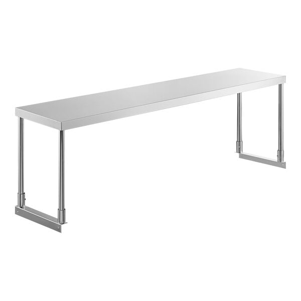 A long rectangular stainless steel shelf above a table.