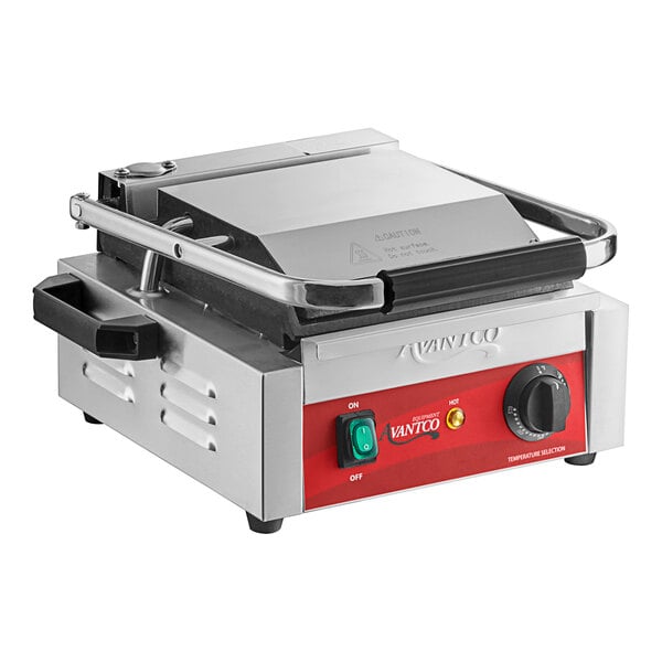 An Avantco commercial panini grill with a red and black handle.