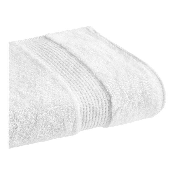 A white towel with a textured edge.