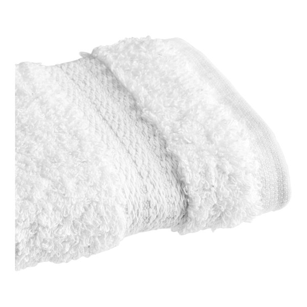 A white 1888 Mills washcloth with a fluffy edge on a white background.