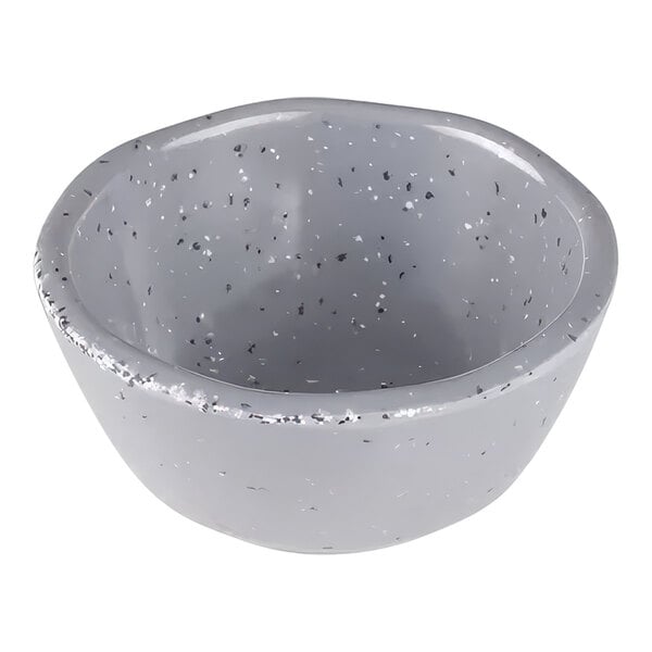 An Elite Global Solutions granite stone ramekin with speckled edges.