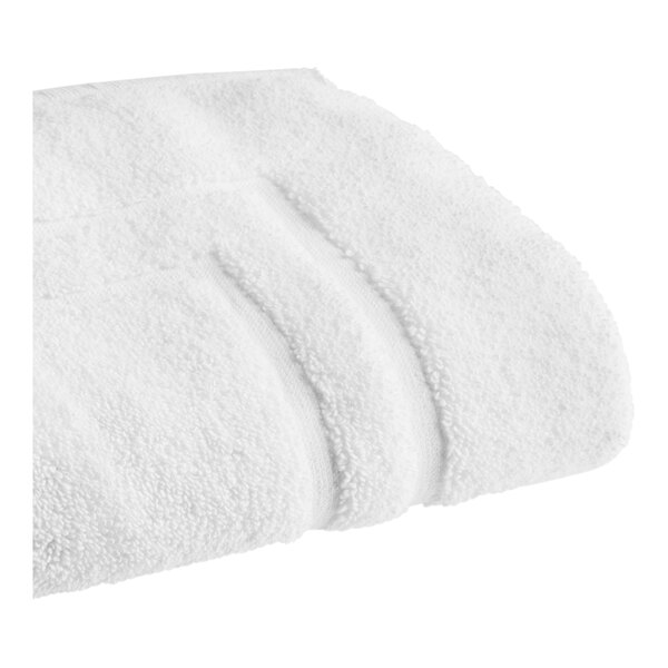 A close-up of a white Sweet South bath mat.