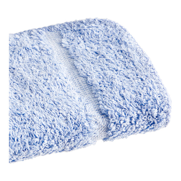 A blue washcloth with a white stripe.