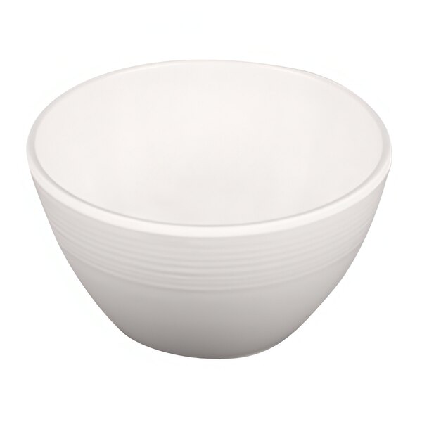 An Elite Global Solutions Maya cream melamine bowl with a curved edge on a white background.