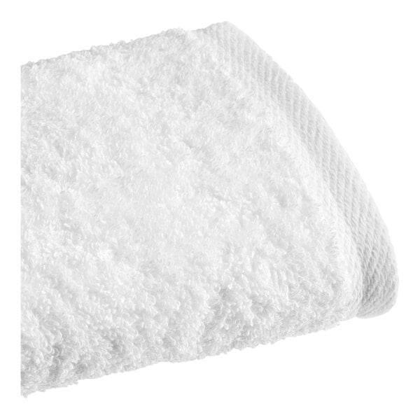 A close up of a white 1888 Mills hand towel.