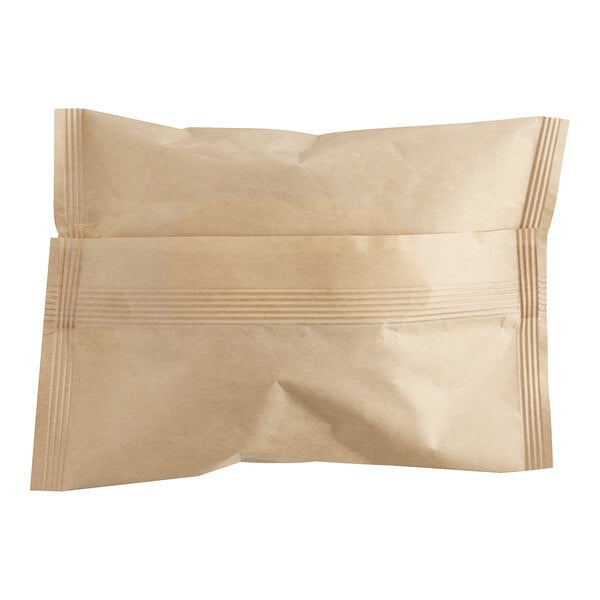 A brown bag with a strip of paper with "Grand Prairie Turkey Sausage, Egg, and Cheese Muffin Sandwich" written on it.