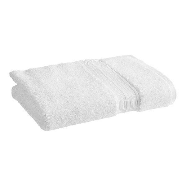 A folded white 1888 Mills Sweet South bath towel.