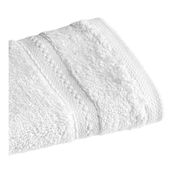 A close up of a 1888 Mills Pure Terry white washcloth.