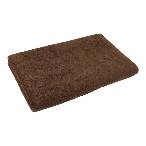 A brown 1888 Mills Coco bath towel.